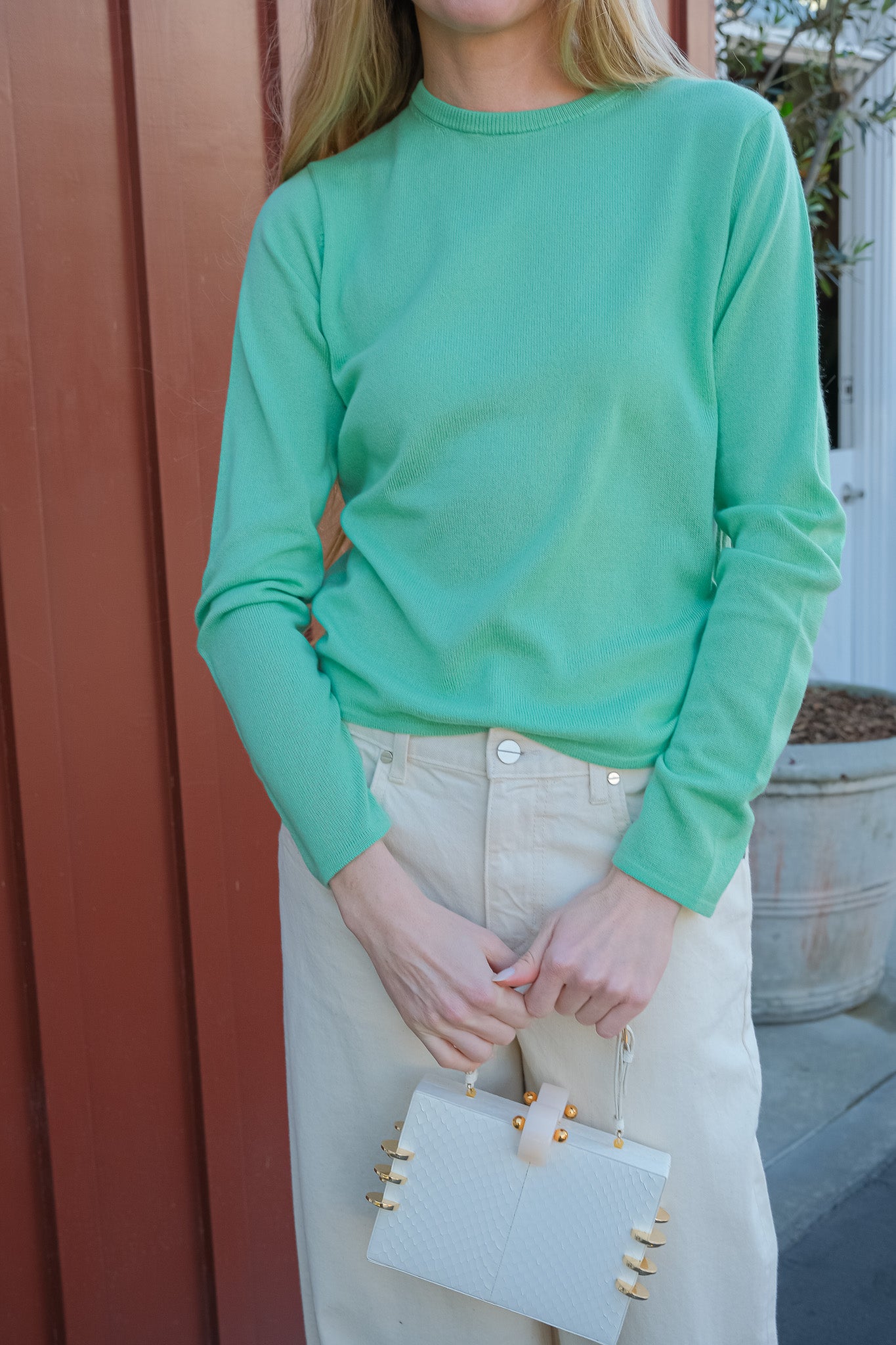 Mint green silk cashmere knit from Auralee. Long sleeves and crew neckline. Available in Brentwood, CA and Charlotte, NC.