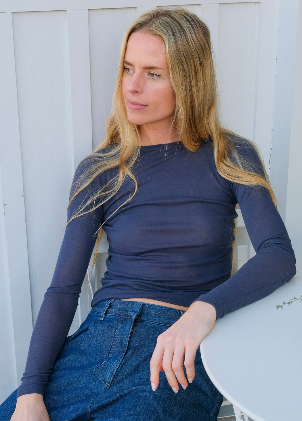 Navy blue knit tee from Auralee. Semi sheer with slim fit and long sleeves. Available in Charlotte, NC and Brentwood, CA.