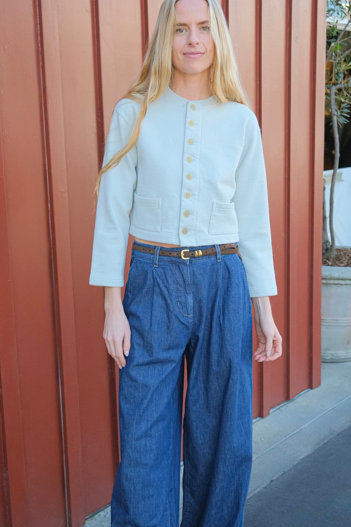 Pale mint colored cardigan jacket from Auralee. Button front and long sleeves with two front pockets. Available in Charlotte, NC and Brentwood, CA.