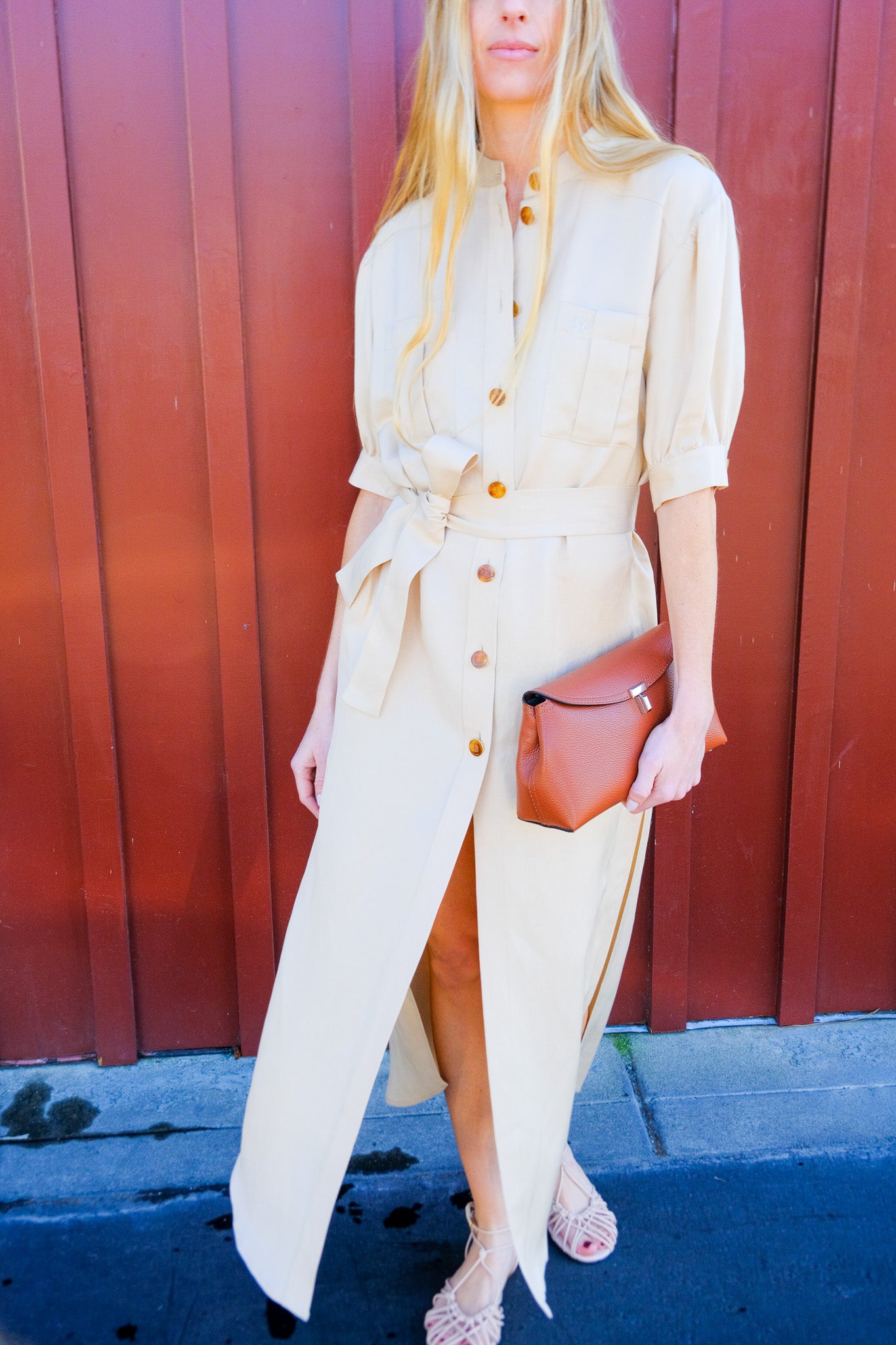 BLAZE | BERBER LONG DRESS IN DONZI CHAMPAGNE | Short sleeve maxi dress | Full amber colored button front | Oversized fit in feminine silhouette | Elbow length sleeves | Mandarin collar neckline |
Fixed waist belt | Center pleated chest pockets | Side slits | Champagne color way | Composition: 68% Viscose 32% Hemp, Lining: Viscose | Care: Professionally dry clean | Made in Italy | Available in Brentwood, CA