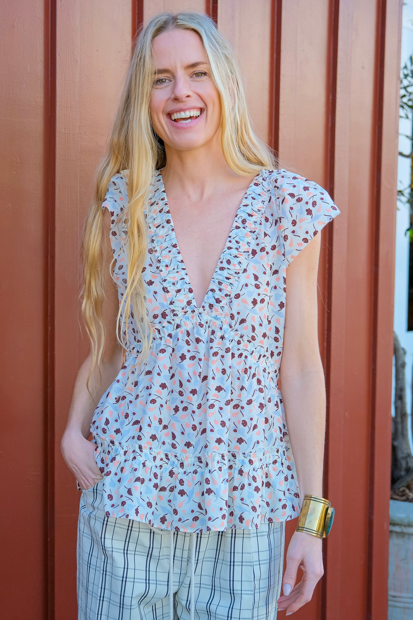 Lee Matthews printed holly top with v-neckline and flutter sleeves in Brentwood, CA and Charlotte, NC.