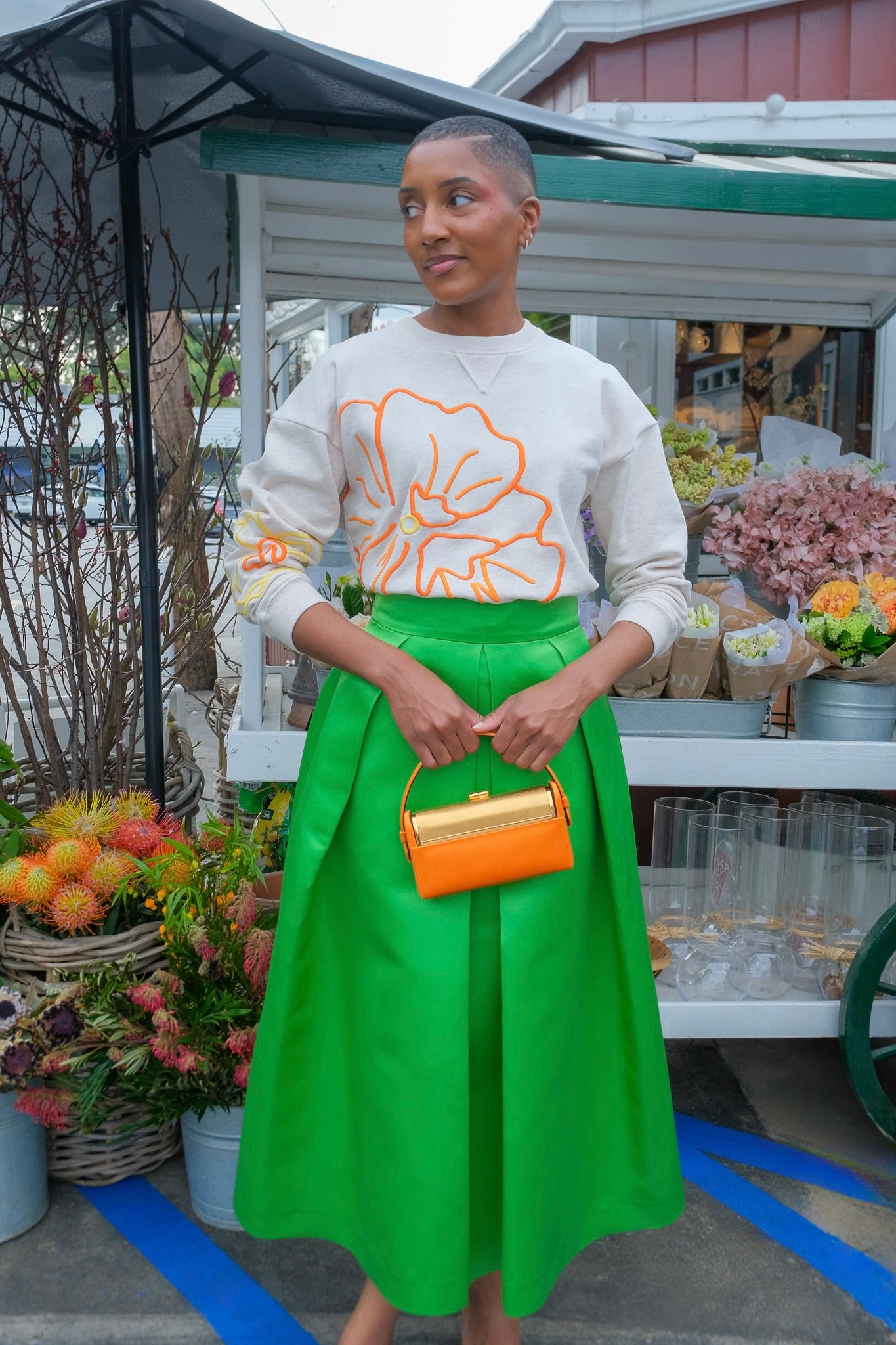Green silk pleated midi skirt from Martin Grant with a fluid A-line silhouette and hidden zip closure. Available in Brentwood, CA and Charlotte, NC.