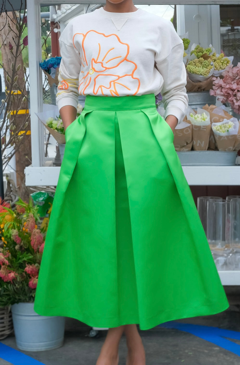 Green silk pleated midi skirt from Martin Grant with a fluid A-line silhouette and hidden zip closure. Available in Brentwood, CA and Charlotte, NC.