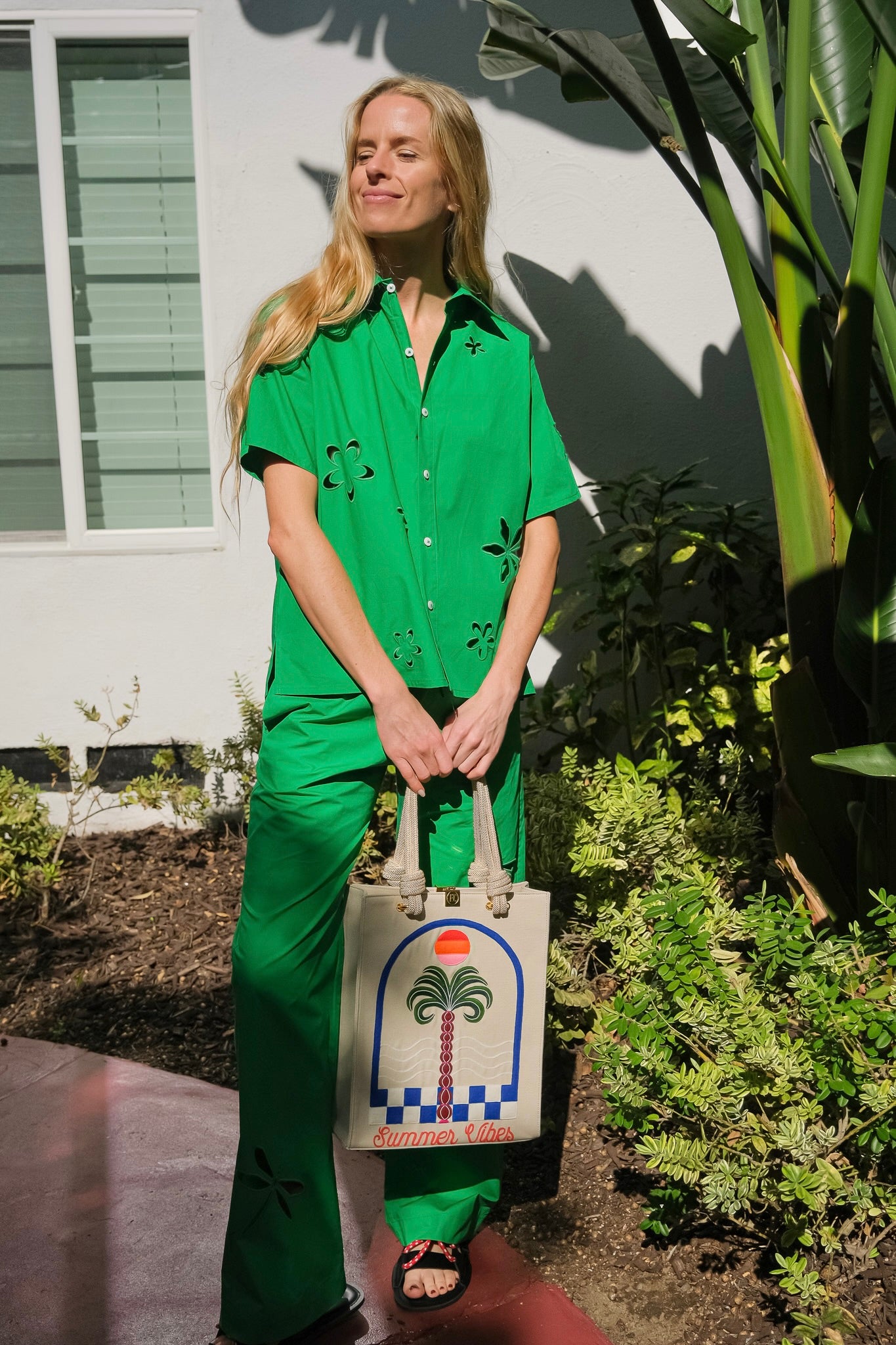 Mira Mikati green trousers with dragonfly cutout available in Charlotte, NC and Brentwood, CA.