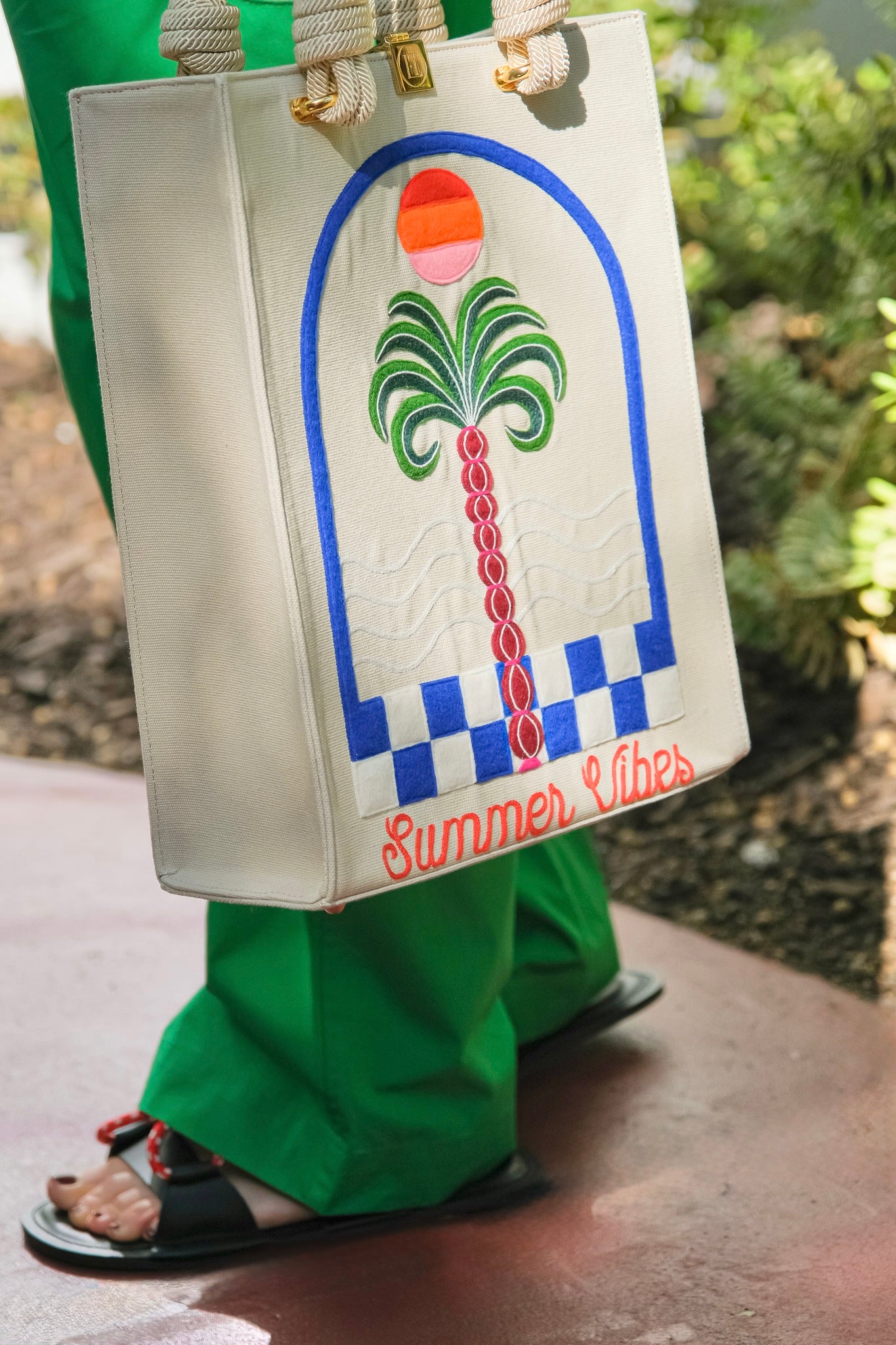 "Summer Vibes" tote from Olympia Le Tan with a palm tree design and embroidery. Available in Brentwood, CA.