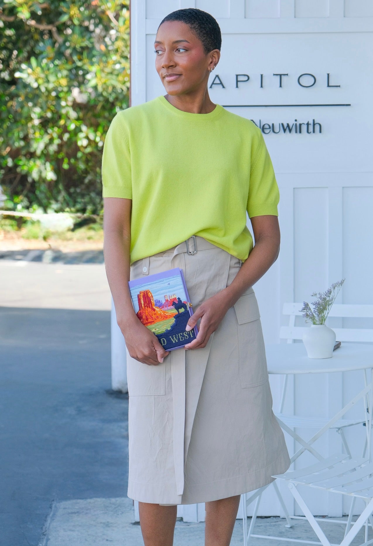 Sand colored utility wrap skirt from Plan C with a belted waist. Available in Charlotte, NC and Brentwood, CA.