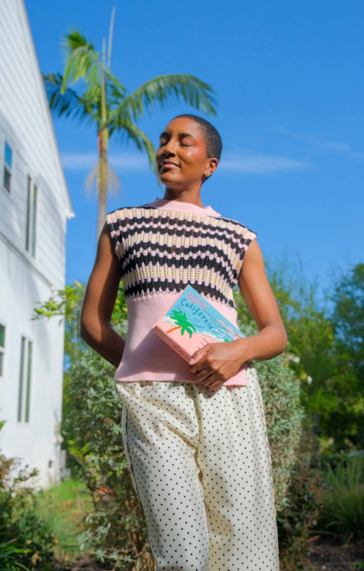 Pink, black, and yellow striped vest from Plan C with a textured weave. Available in Brentwood, CA and Charlotte, NC.