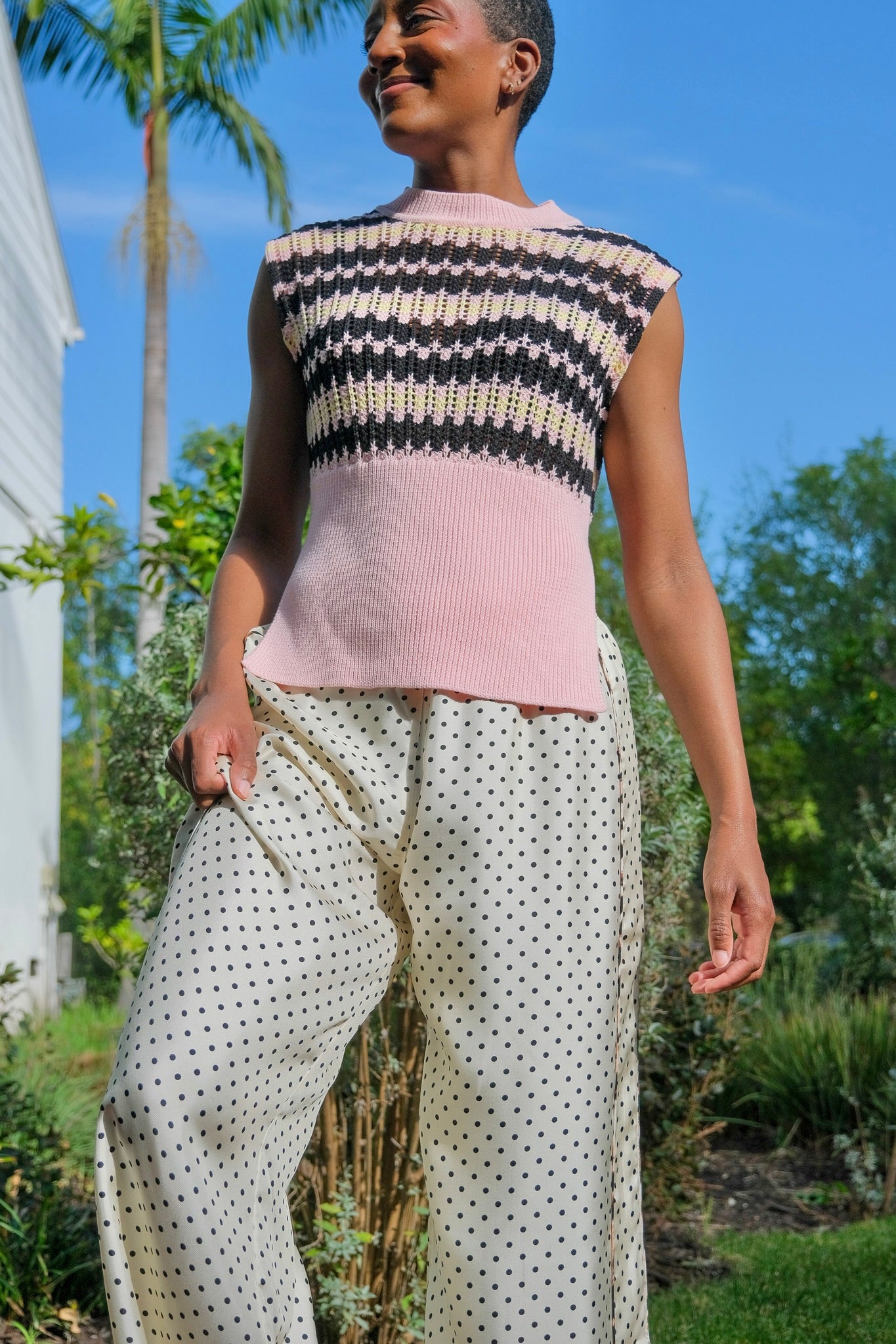 Pink, black, and yellow striped vest from Plan C with a textured weave. Available in Brentwood, CA and Charlotte, NC.