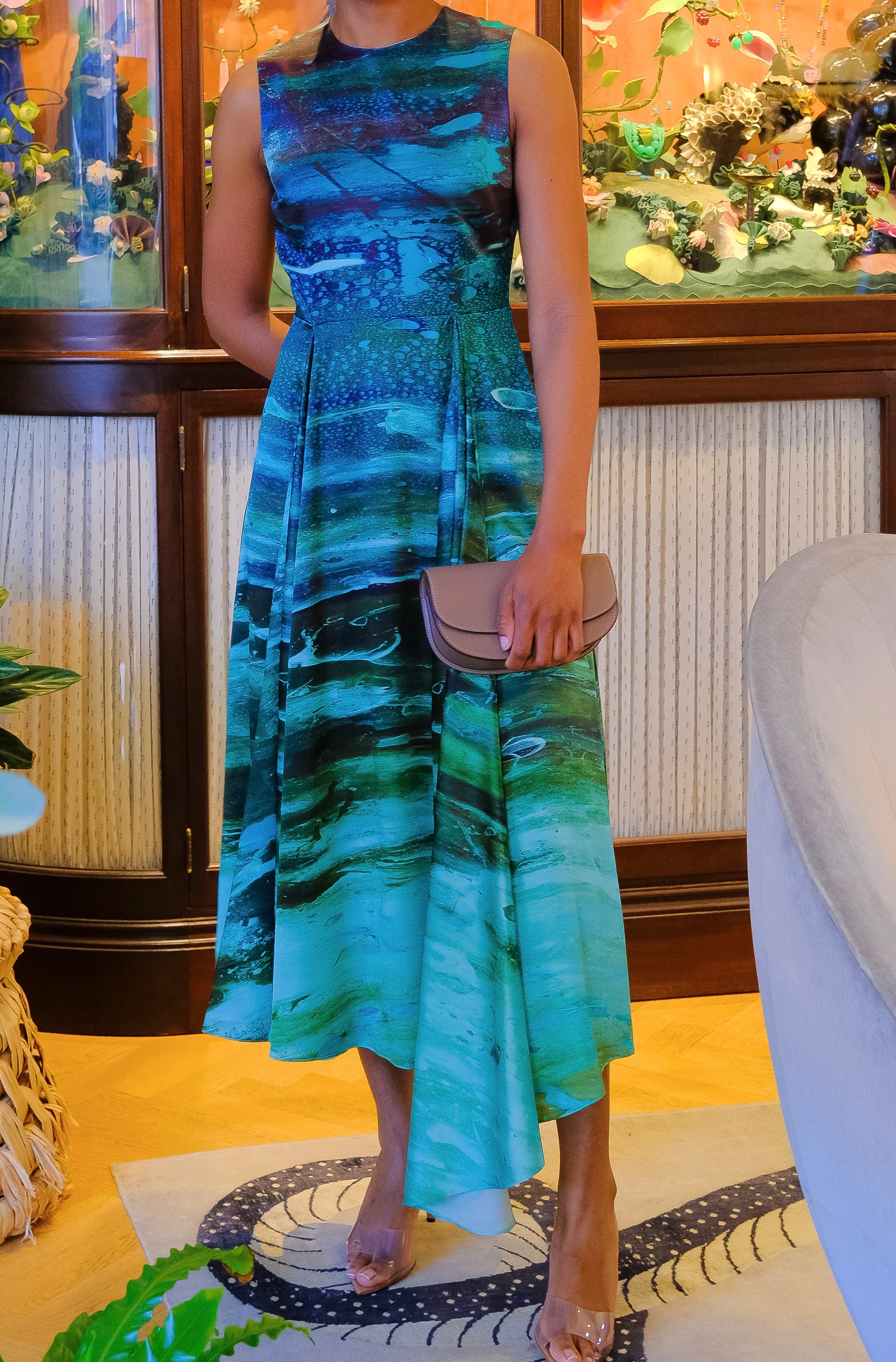 Blue printed Tera dress from Roksanda. Features and asymmetrical midi skirt, fitted waist, and a-line silhouette. Available in Charlotte, NC and Brentwood, CA.