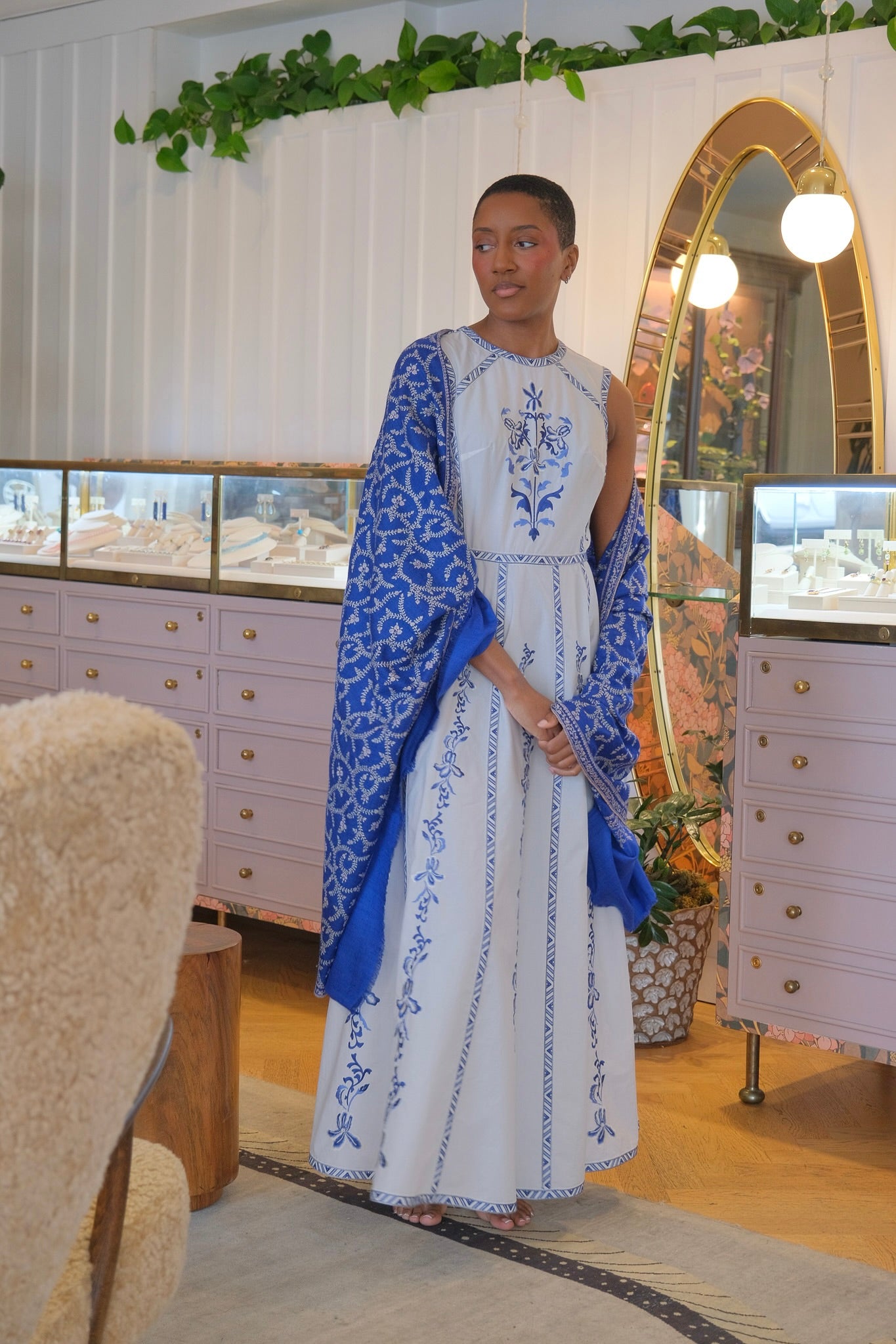 Royal blue Yaser Shaw shawl with all over white vine design available in Brentwood, CA.