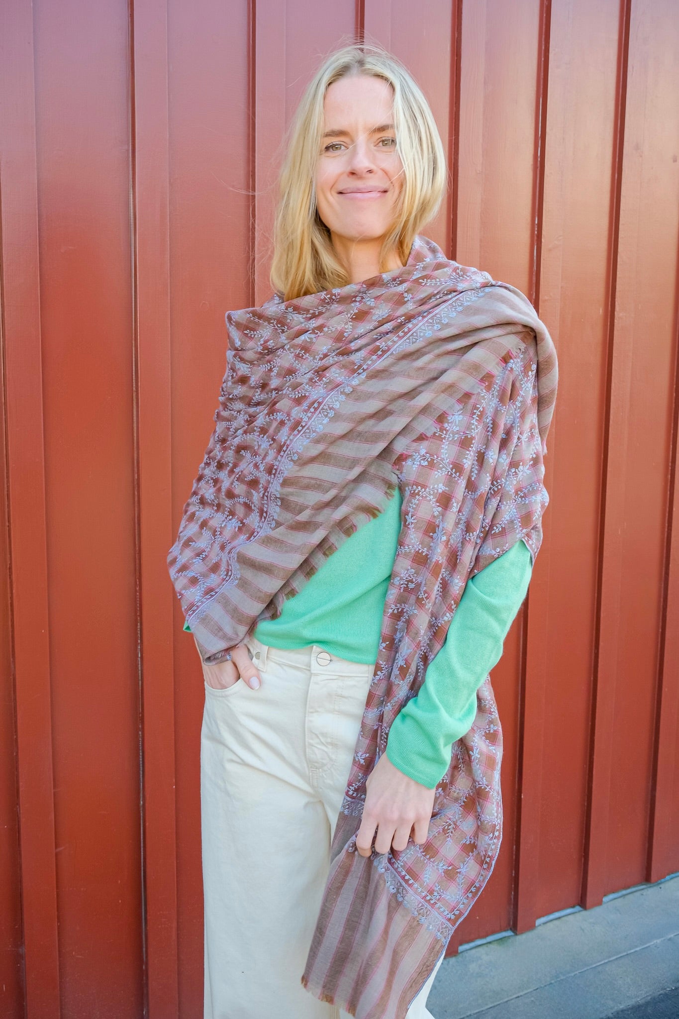 Yaser Shaw vine shawl on brown and red plaid background. Available in Brentwood, CA and Charlotte, NC.
