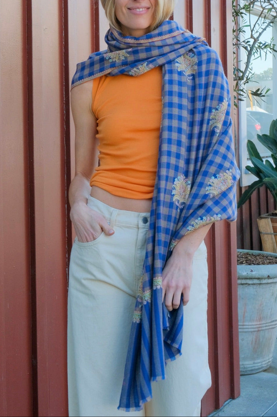 Yaser shaw shawl with motif embroidery and royal blue plaid background available in Brentwood, CA and Charlotte, NC.