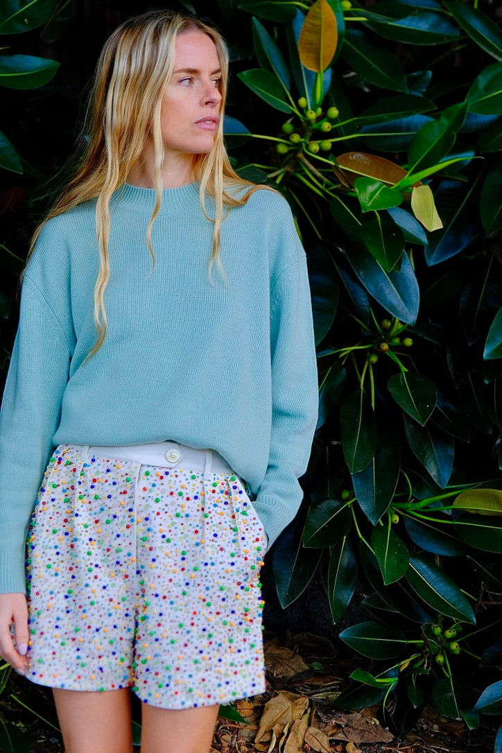 White shorts from Alix of Bohemia with confetti beading throughout. Available in Charlotte, NC and Brentwood, CA.