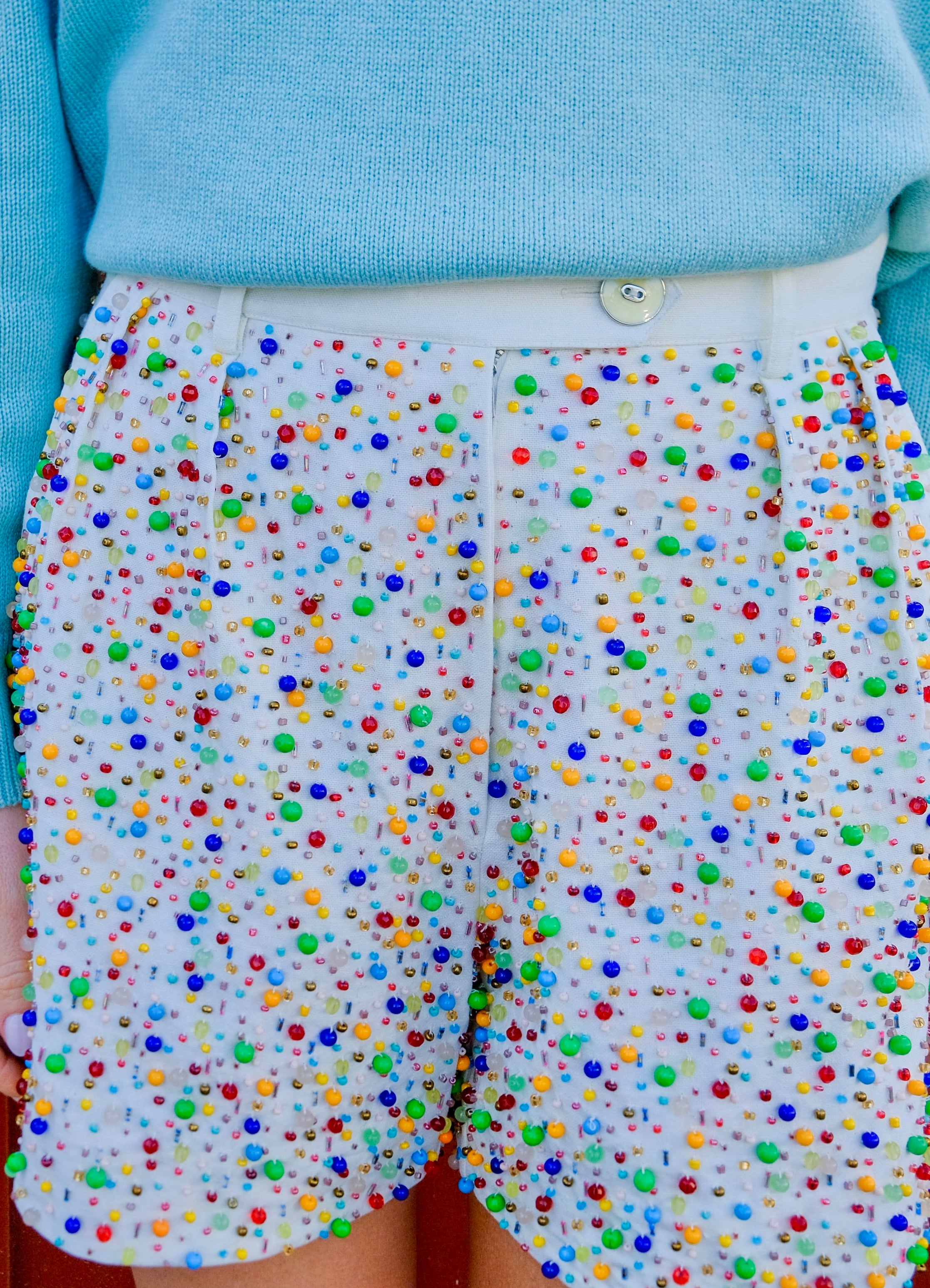 White shorts from Alix of Bohemia with confetti beading throughout. Available in Charlotte, NC and Brentwood, CA.
