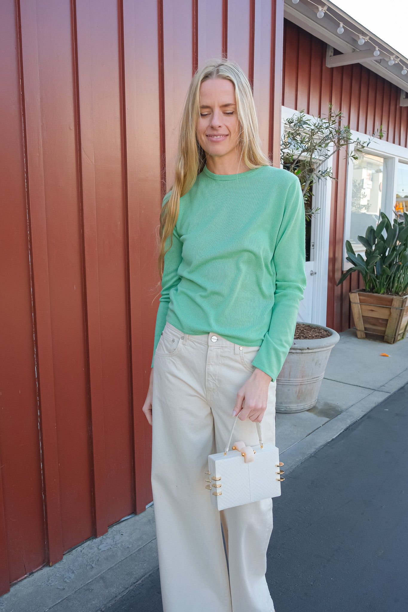 Mint green silk cashmere knit from Auralee. Long sleeves and crew neckline. Available in Brentwood, CA and Charlotte, NC.