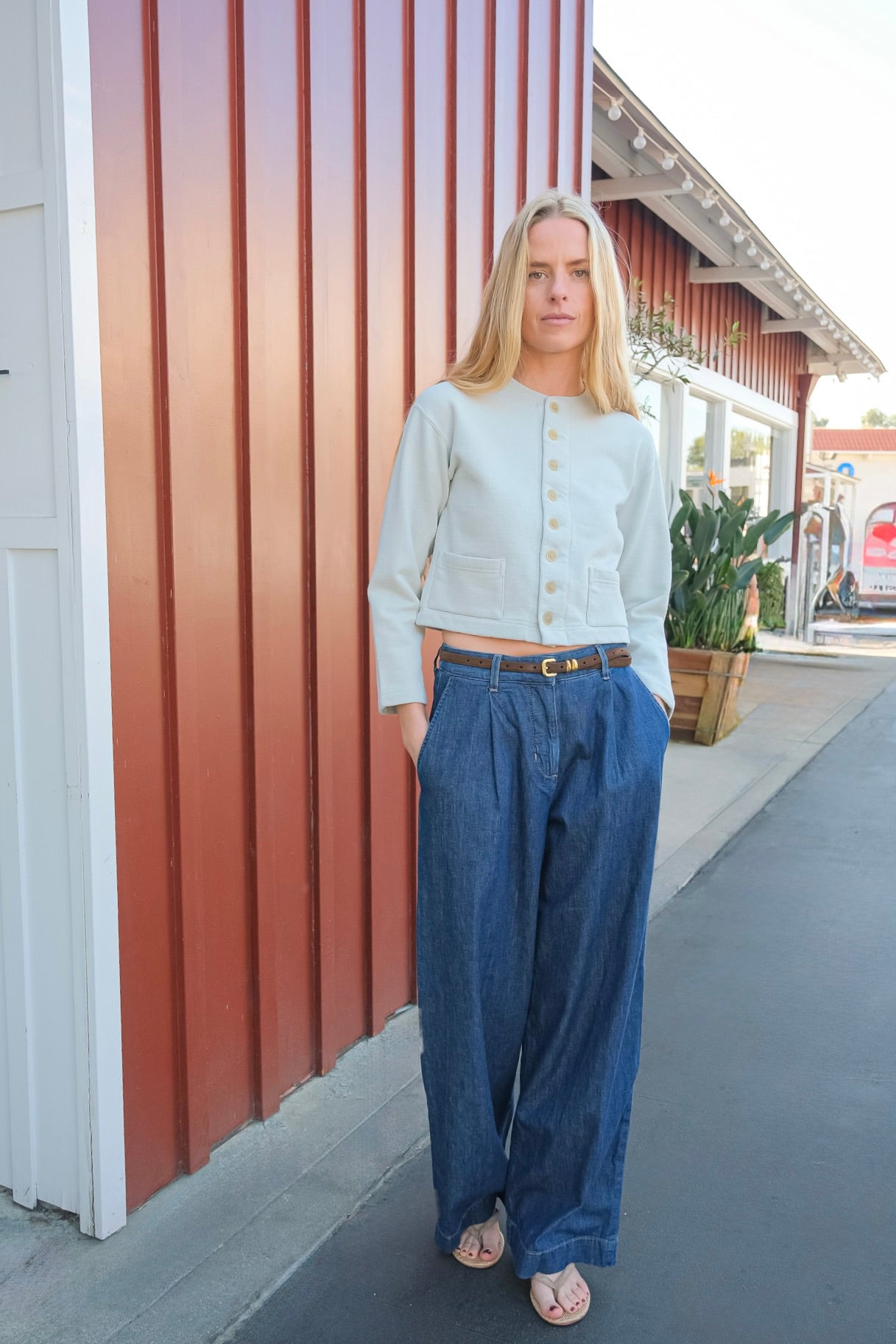 Pale mint colored cardigan jacket from Auralee. Button front and long sleeves with two front pockets. Available in Charlotte, NC and Brentwood, CA.