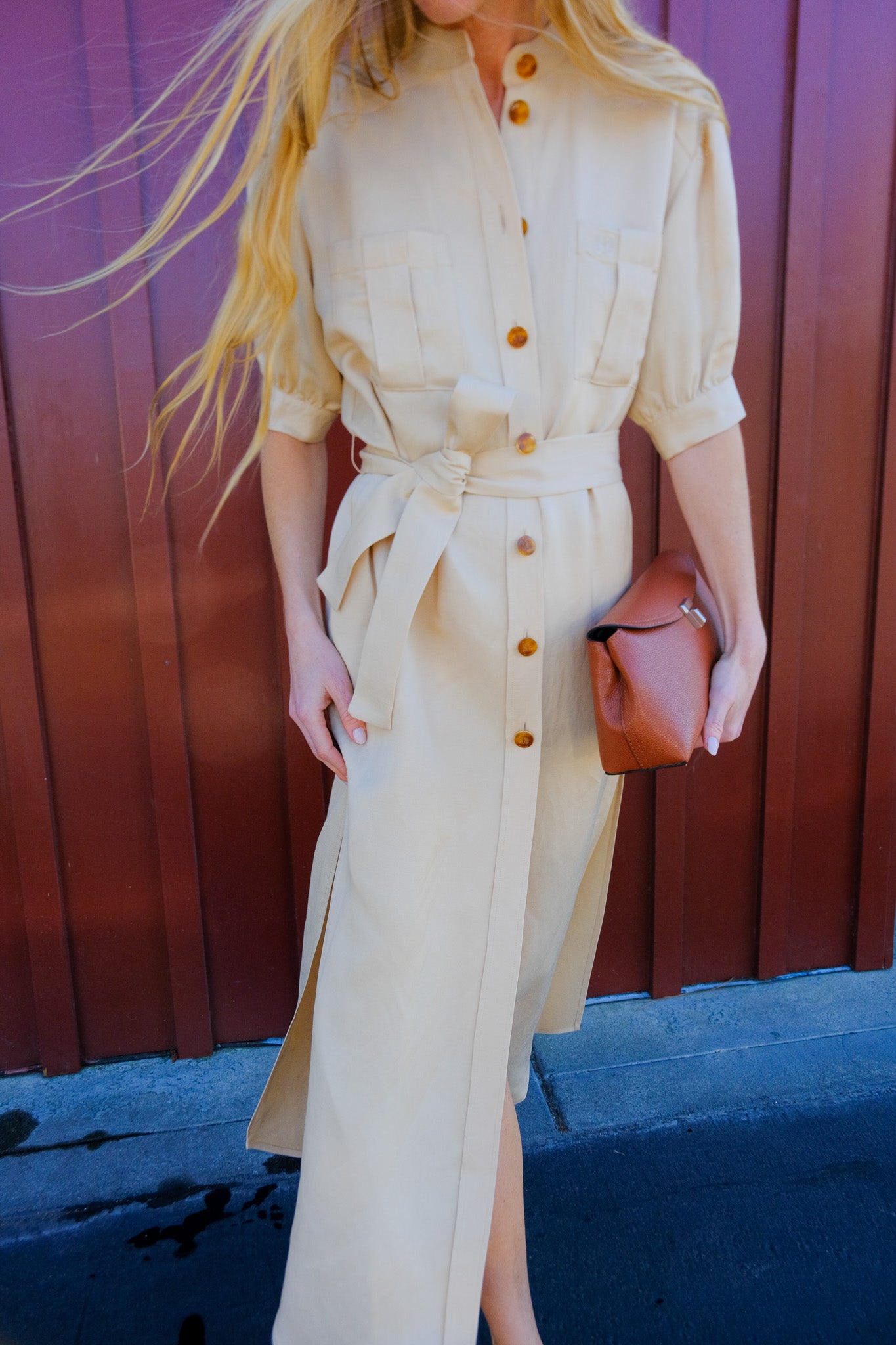 BLAZE | BERBER LONG DRESS IN DONZI CHAMPAGNE | Short sleeve maxi dress | Full amber colored button front | Oversized fit in feminine silhouette | Elbow length sleeves | Mandarin collar neckline |
Fixed waist belt | Center pleated chest pockets | Side slits | Champagne color way | Composition: 68% Viscose 32% Hemp, Lining: Viscose | Care: Professionally dry clean | Made in Italy | Available in Brentwood, CA