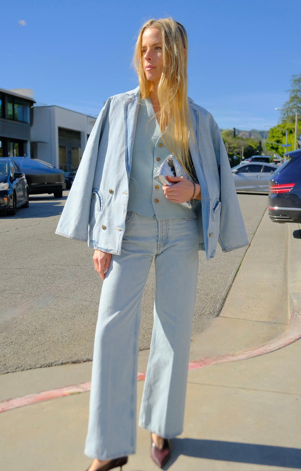 Medium-wash denim jacket from Blazé Milano with classic collar and patch pockets in a relaxed boxy silhouette. Available in Brentwood, CA and Charlotte, NC.