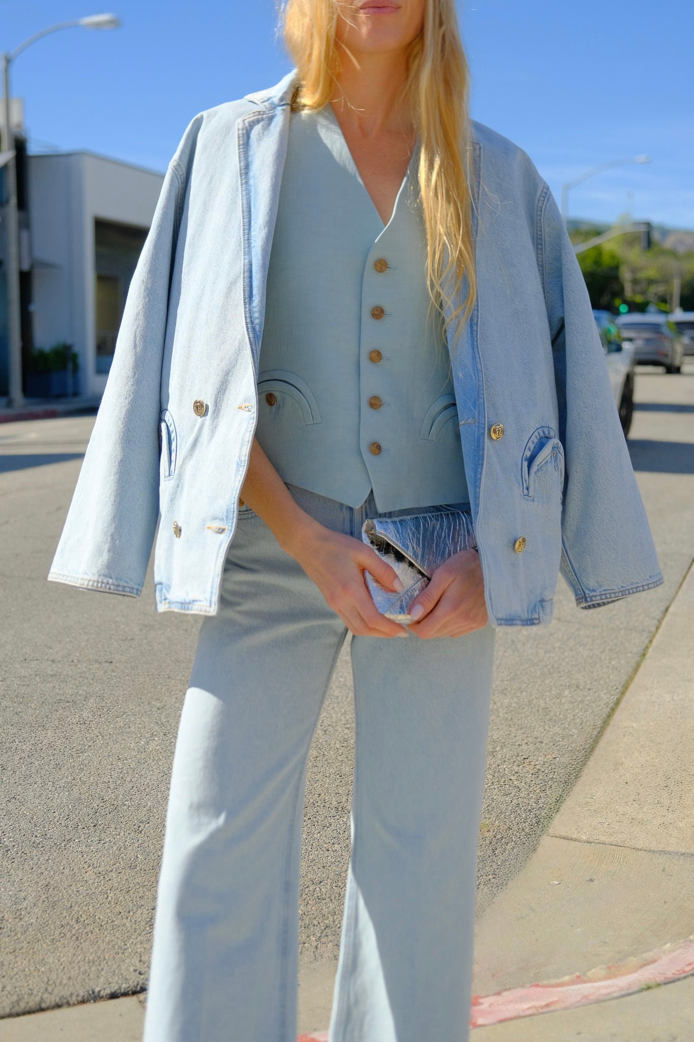 Medium-wash denim jacket from Blazé Milano with classic collar and patch pockets in a relaxed boxy silhouette. Available in Brentwood, CA and Charlotte, NC.