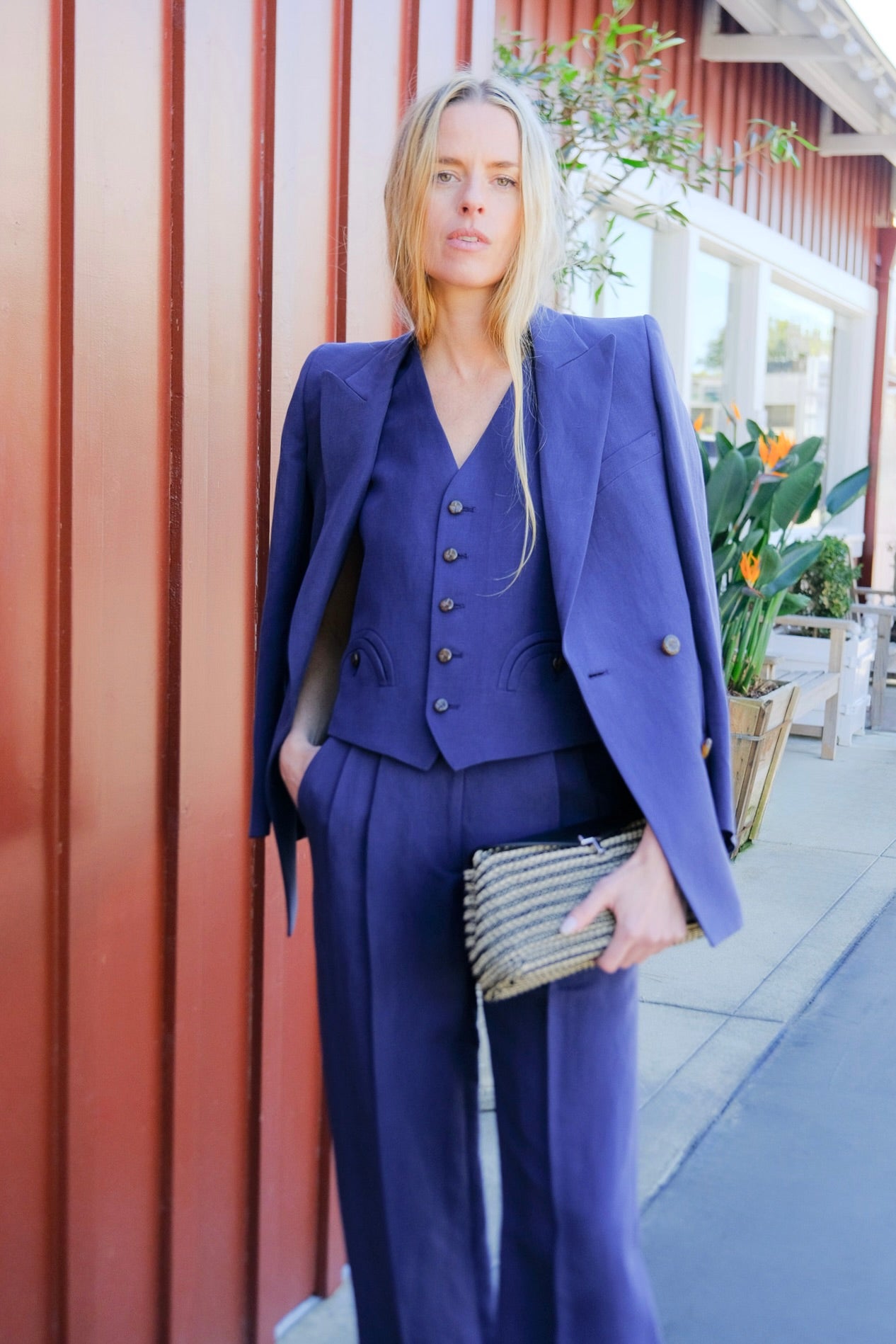 Navy linen-silk blend double-breasted blazer from Blazé Milano with peak lapels and signature curved pockets. Available in Brentwood, CA and Charlotte, NC.