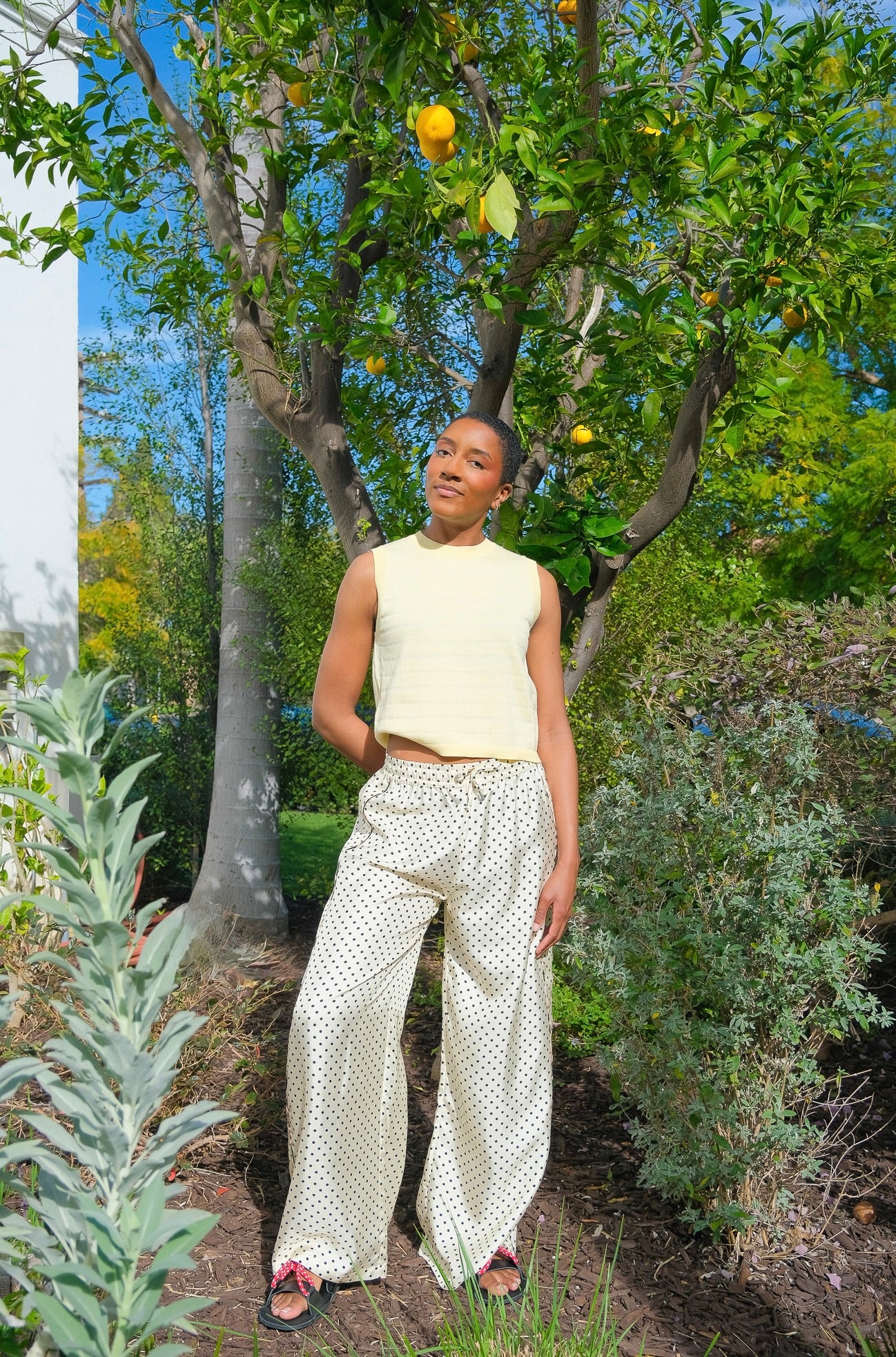 Polka dot wide-leg silk trousers from La Prestic Ouiston with a striped side trim and elasticated drawstring waistband. Available in Brentwood, CA and Charlotte, NC.