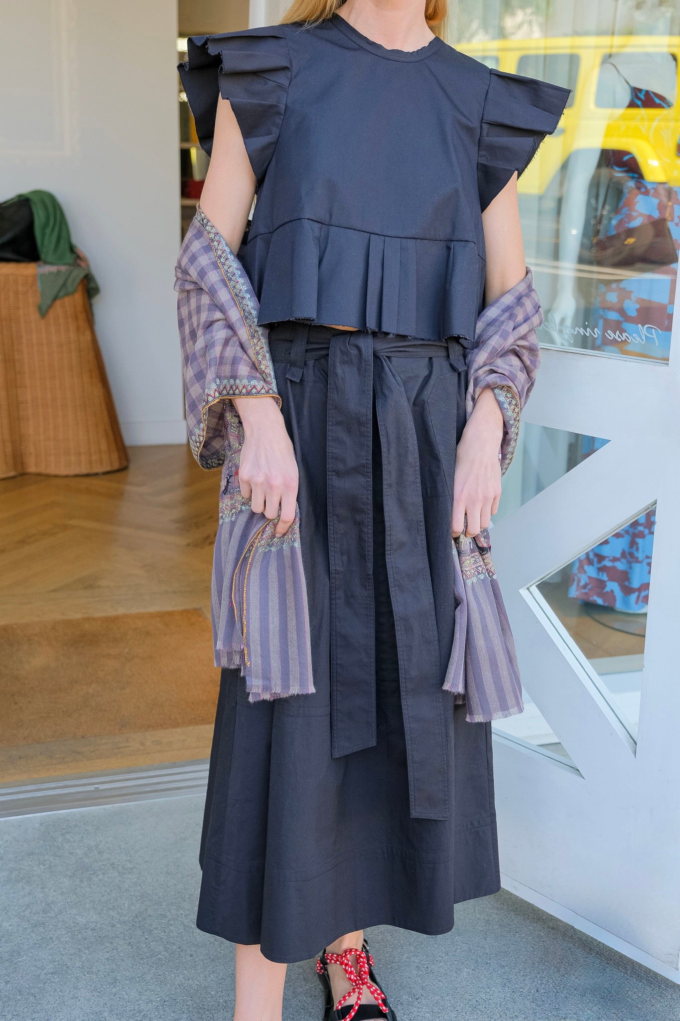 Lee Mathews black poplin midi skirt with belted waist and flared silhouette. Available in Charlotte, NC and Brentwood, CA.