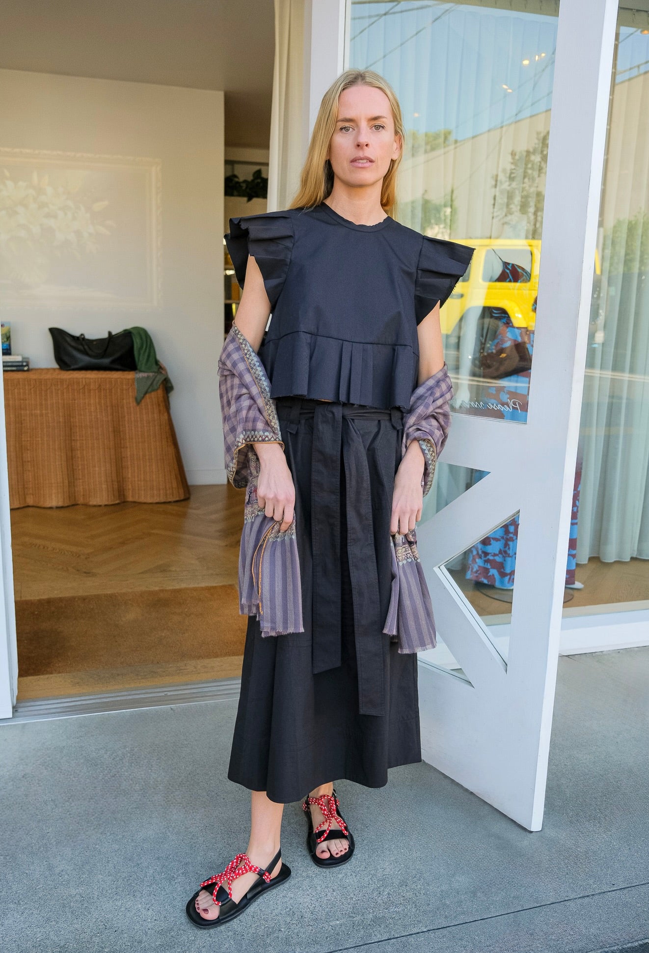 Lee Mathews black poplin midi skirt with belted waist and flared silhouette. Available in Charlotte, NC and Brentwood, CA.