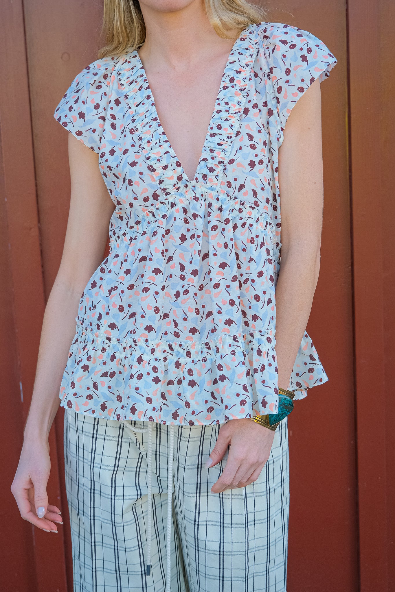 Lee Matthews printed holly top with v-neckline and flutter sleeves in Brentwood, CA and Charlotte, NC.