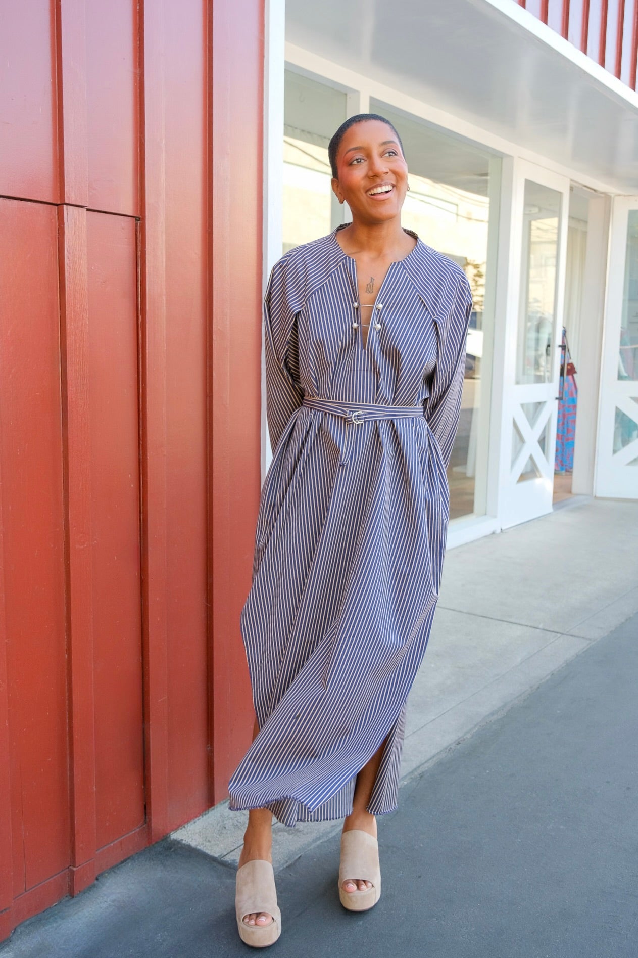 Long blue and white striped dress with a belted waist and double pearl pins located in Charlotte, NC and Brentwood, CA.