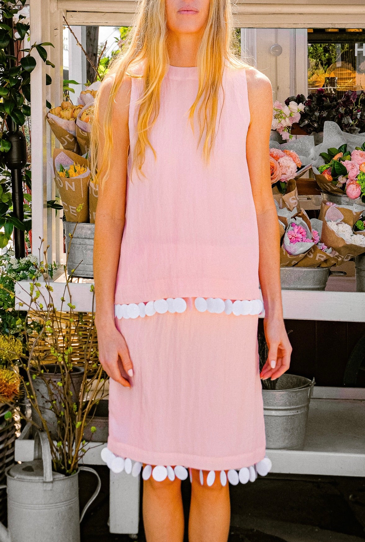 Pink viscose knee-length slip skirt from Plan C with oversized dot sequin embellishment and a straight silhouette. Available in Brentwood, CA and Charlotte, NC.