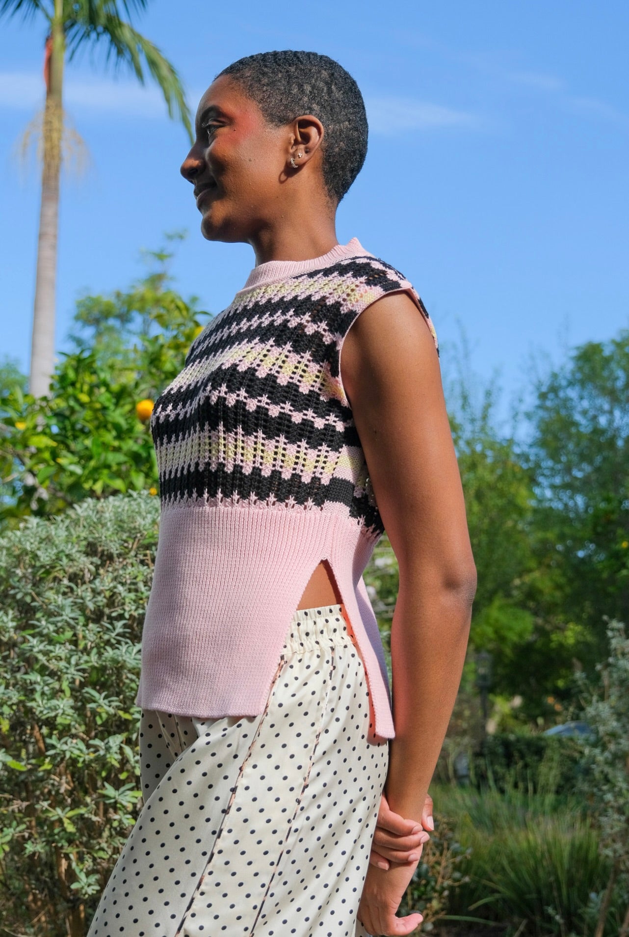 Pink, black, and yellow striped vest from Plan C with a textured weave. Available in Brentwood, CA and Charlotte, NC.