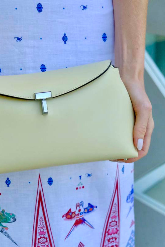 TOTEME | T-LOCK LEATHER CLUTCH CHAMPAGNE | WOMEN'S LUXURY DESIGNER CLOTHING, JEWELRY & ACCESSORIES | CAPITOL CHARLOTTE, NC & BRENTWOOD, CA