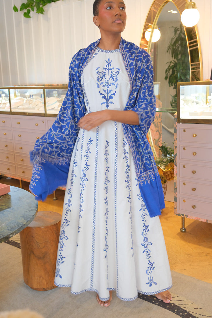Royal blue Yaser Shaw shawl with all over white vine design available in Brentwood, CA.