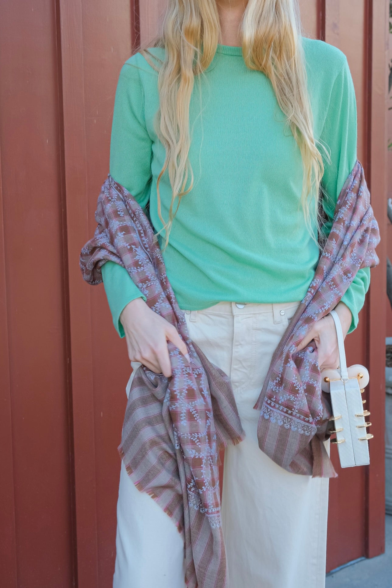 Yaser Shaw vine shawl on brown and red plaid background. Available in Brentwood, CA and Charlotte, NC.