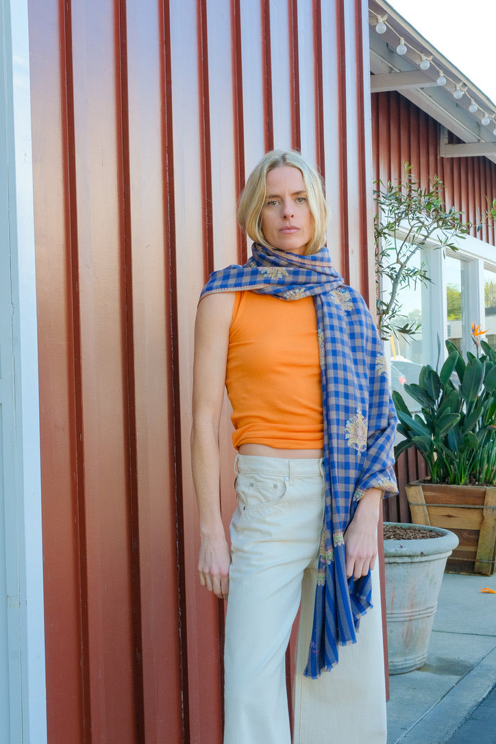 Yaser shaw shawl with motif embroidery and royal blue plaid background available in Brentwood, CA and Charlotte, NC.